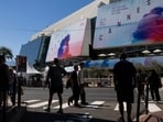 Pedestrians walk past posters of the 78th edition of the Cannes Film Festival outside the Palais des Festivals. (Photo by SAMEER AL-DOUMY / AFP) Pedestrians walk past posters of the 78th edition of the Cannes Film Festival outside the Palais des Festivals. (Photo by SAMEER AL-DOUMY / AFP)