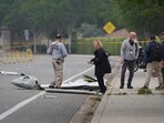 Investigators work at the site of a plane crash Friday, May 23, 2025, in San Diego. 