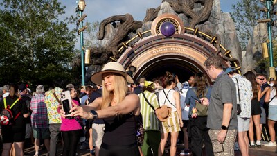 FILE PHOTO: An attendee uses her phone to take a selfie before entering the "Dark Universe" world at Universal Epic Universe theme park ahead of the grand opening ceremony in Orlando, Florida, U.S. May 21, 2025. REUTERS/Marco Bello/File Photo (REUTERS)