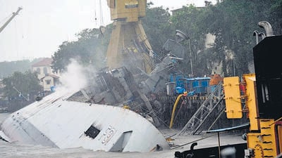 INS Brahmaputra tipped over last year after a fire on board. (ANI File) INS Brahmaputra tipped over last year after a fire on board. (ANI File)