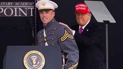 President Donald Trump pats graduating cadet Bryson Daily on the back, who is an American college football quarterback for the Army Black Knights, during the United States Military Academy commencement ceremonies in West Point, N.Y., Saturday, May 24, 2025. (AP Photo/Adam Gray) (AP) President Donald Trump pats graduating cadet Bryson Daily on the back, who is an American college football quarterback for the Army Black Knights, during the United States Military Academy commencement ceremonies in West Point, N.Y., Saturday, May 24, 2025. (AP Photo/Adam Gray) (AP)