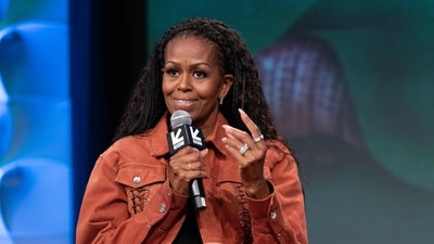 Former US First Lady Michelle Obama sparked divorce rumors with her 'flirty' conversation with a billionaire (AFP) Former US First Lady Michelle Obama sparked divorce rumors with her 'flirty' conversation with a billionaire (AFP)