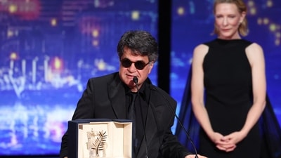 Iranian director and screenwriter and producer Jafar Panahi delivers a speech after winning the Palme d'Or for the film "Un simple accident" (A Simple Accident) during the closing ceremony at the 78th edition of the Cannes Film Festival in Cannes, southern France, on May 24, 2025. (Photo by Sameer AL-DOUMY / AFP) (AFP) Iranian director and screenwriter and producer Jafar Panahi delivers a speech after winning the Palme d'Or for the film "Un simple accident" (A Simple Accident) during the closing ceremony at the 78th edition of the Cannes Film Festival in Cannes, southern France, on May 24, 2025. (Photo by Sameer AL-DOUMY / AFP) (AFP)