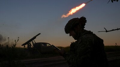 Members of the National Police Special Purpose Battalion of Zaporizhzhia region fire a Partizan multiple rocket launcher towards Russian troops on a front line. (REUTERS)