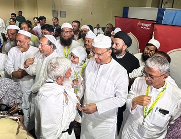 Kolkata, May 16 (ANI): Kolkata Mayor Firhad Hakim meets Hajj pilgrims as they depart for the pilgrimage to Mecca, at NSCBI Airport in Kolkata on Friday. (ANI Photo) (Saikat Paul)