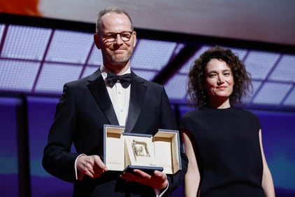 Director Joachim Trier, Grand Prix award winner for the film film "Affeksjonsverdi" (Sentimental Value - Valeur Sentimentale), poses with Coralie Fargeat during the closing ceremony of the 78th Cannes Film Festival in Cannes, France, May 24, 2025. REUTERS/Manon Cruz (REUTERS)