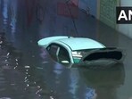 A car submerged underwater after heavy rainfall in Delhi A car submerged underwater after heavy rainfall in Delhi