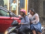 People travelling in the the rain at Tardev in Mumbai. People travelling in the the rain at Tardev in Mumbai.