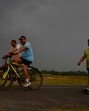Residents enjoying cycling moments before a thunderstorm hit the city, bringing relief from heat on Saturday. (Gurpreet Singh/HT) Residents enjoying cycling moments before a thunderstorm hit the city, bringing relief from heat on Saturday. (Gurpreet Singh/HT)