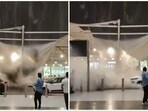 As the rain intensifies, the membrane shade partially collapses, giving way and allowing water to pour down onto the vehicles and flow toward those nearby, prompting them to move away.