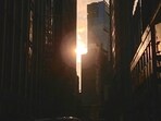 Manhattanhenge is a stunning natural event occurring twice a year when the sunset aligns with Manhattan's grid.