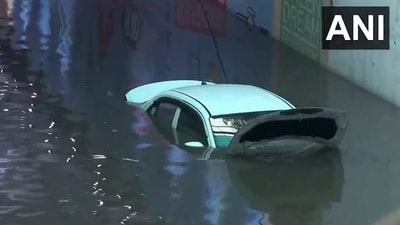 A car submerged underwater after heavy rainfall in Delhi (X/@ANI) A car submerged underwater after heavy rainfall in Delhi (X/@ANI)