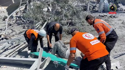 Rescuers place a casualty to transport them on a stretcher, in Khan Younis, Gaza, May 23, 2025. (REUTERS)