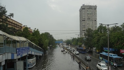 Commuters had to wade through waterlogged road following rains near ITO in Delhi. (PTI) Commuters had to wade through waterlogged road following rains near ITO in Delhi. (PTI)