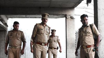 Police personnel at the crime scene in Lucknow on Sunday. (HT Photo) Police personnel at the crime scene in Lucknow on Sunday. (HT Photo)