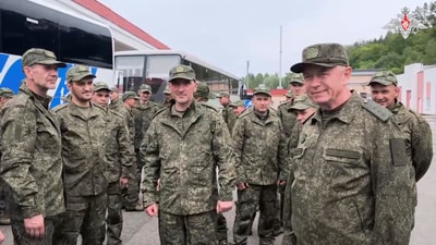 A still image from a video released by Russia's Defence Ministry shows Deputy Defence Minister Alexander Fomin meeting with Russian service personnel, who were said to be captured by Ukrainian forces and released on the third day of the latest exchange of prisoners of war in the course of Russia-Ukraine conflict, at an unknown location in Belarus, in this image taken from handout footage released May 25, 2025. (via REUTERS)