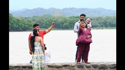 Visitors enjoying the pleasant weather following overnight light rain at Sukhna Lake in Chandigarh on Sunday. (Keshav Singht/HT) Visitors enjoying the pleasant weather following overnight light rain at Sukhna Lake in Chandigarh on Sunday. (Keshav Singht/HT)