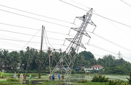 Restoration work underway after a KSEB high tension tower tilted following heavy rainfall, at Nallalam, in Kozhikode, Kerala, Saturday, May 24, 2025. (PTI) Restoration work underway after a KSEB high tension tower tilted following heavy rainfall, at Nallalam, in Kozhikode, Kerala, Saturday, May 24, 2025. (PTI)