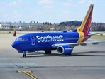 Southwest Airlines ends 50-year policy of free checked bags, implementing fees for many travelers starting Wednesday. (AP Photo/Gene J. Puskar, File)
