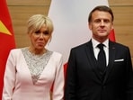 France's President Emmanuel Macron (R) poses with his wife Brigitte Macron during a state dinner with Vietnam's President Luong Cuong at the International Convention Center in Hanoi on May 26, 2025. (Photo by Ludovic MARIN / AFP) France's President Emmanuel Macron (R) poses with his wife Brigitte Macron during a state dinner with Vietnam's President Luong Cuong at the International Convention Center in Hanoi on May 26, 2025. (Photo by Ludovic MARIN / AFP)