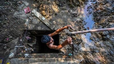 Drain cleaning on Outer Ring Road. (RAJ K RAJ /HT PHOTO) Drain cleaning on Outer Ring Road. (RAJ K RAJ /HT PHOTO)