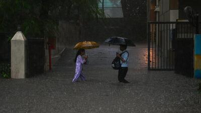 Most parts of the island city received over 100mm rain, and people made their way through waist-deep water (Raju Shinde/ Hindustan Times)