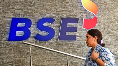 A woman walks into the Bombay Stock Exchange (BSE) building, in Mumbai. (PTI) A woman walks into the Bombay Stock Exchange (BSE) building, in Mumbai. (PTI)