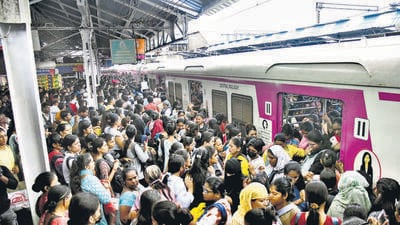Thane, India - May -26, 2025: A crowd of passengers is seen at morning Thane railway station as trains are running late due to heavy rain. .,in Thane,in Mumbai, India, on, monday, May -26, 2025. ( Praful Gangurde /HT Photo ) Thane, India - May -26, 2025: A crowd of passengers is seen at morning Thane railway station as trains are running late due to heavy rain. .,in Thane,in Mumbai, India, on, monday, May -26, 2025. ( Praful Gangurde /HT Photo )