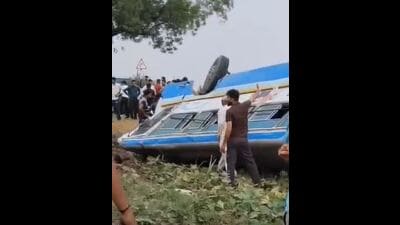 The overturned bus after the driver lost control while avoiding crashing into an uprooted tree on the Rajli-Hisar road on Monday. (HT Photo)
