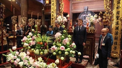France's President Emmanuel Macron (C-R) and Vietnam's General Secretary of the Communist Party To Lam (C) visit the Temple of Literature in Hanoi on May 26, 2025. (Photo by Ludovic MARIN / AFP) (AFP) France's President Emmanuel Macron (C-R) and Vietnam's General Secretary of the Communist Party To Lam (C) visit the Temple of Literature in Hanoi on May 26, 2025. (Photo by Ludovic MARIN / AFP) (AFP)
