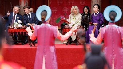 France's President Emmanuel Macron (2nd L), his wife Brigitte Macron (2nd R), Vietnam's General Secretary of the Communist Party To Lam (L) and his wife Ngo Phuong Ly (R) attend a ceremony at the Temple of Literature in Hanoi on May 26, 2025. (Photo by Ludovic MARIN / AFP) (AFP) France's President Emmanuel Macron (2nd L), his wife Brigitte Macron (2nd R), Vietnam's General Secretary of the Communist Party To Lam (L) and his wife Ngo Phuong Ly (R) attend a ceremony at the Temple of Literature in Hanoi on May 26, 2025. (Photo by Ludovic MARIN / AFP) (AFP)