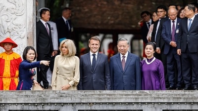 France's President Emmanuel Macron, his wife Brigitte Macron (C-L), Vietnam's General Secretary of the Communist Party To Lam and his wife Ngo Phuong Ly (C-R) visit the Temple of Literature in Hanoi on May 26, 2025. (Photo by Ludovic MARIN / AFP) (AFP) France's President Emmanuel Macron, his wife Brigitte Macron (C-L), Vietnam's General Secretary of the Communist Party To Lam and his wife Ngo Phuong Ly (C-R) visit the Temple of Literature in Hanoi on May 26, 2025. (Photo by Ludovic MARIN / AFP) (AFP)