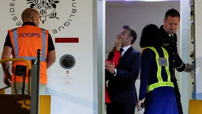 Macron dismissed having a "domestic dispute" with his wife, telling reporters that they were "joking, as we often do." (REUTERS)