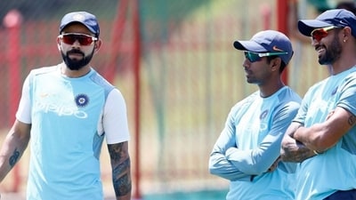 Virat Kohli, left, with Wriddhiman Saha and Shikhar Dhawan (AFP) Virat Kohli, left, with Wriddhiman Saha and Shikhar Dhawan (AFP)