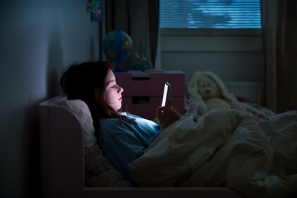 Avoid watching screens at awkward positions, like laying down, puts strain on your eyes. (Shutterstock)