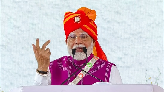 Prime Minister Narendra Modi addresses the gathering during the foundation stone laying and inauguration ceremony of multiple development projects worth around ₹24,000 crore, in Dahod on Monday. (ANI)