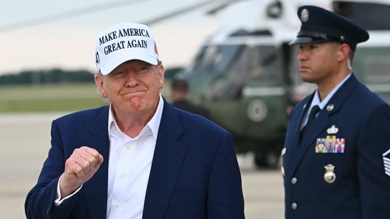US President Donald Trump makes a fist as he disembarks from Air Force One upon arrival at Joint Base Andrews in Maryland, May 25, 2025, after spending the weekend in New Jersey. (AFP)