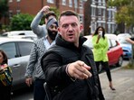 FILE PHOTO: Anti-immigration activist Stephen Yaxley-Lennon, known as Tommy Robinson, gestures before arriving at Folkestone Police Station in Folkestone, Britain, October 25, 2024. REUTERS/Chris J Ratcliffe/File Photo