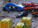 Police and emergency personnel deal with an incident after a car collided with pedestrians near the Liver Building during the Premier League winners parade in Liverpool, England, on Monday. Police and emergency personnel deal with an incident after a car collided with pedestrians near the Liver Building during the Premier League winners parade in Liverpool, England, on Monday.
