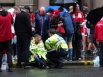 Liverpool horror aftermath: Around twenty people were treated on the scene, and 27 more were hospitalised after a car ploughed into a crowd of fans.