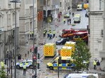 Police and emergency personnel work at the site of the incident where a car collided with pedestrians in Liverpool during the Premier League winners parade on Monday. Police and emergency personnel work at the site of the incident where a car collided with pedestrians in Liverpool during the Premier League winners parade on Monday.