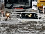A car lies partially submerged as it wades through a flooded street after heavy rain showers in Mumbai on May 26, 2025. A car lies partially submerged as it wades through a flooded street after heavy rain showers in Mumbai on May 26, 2025.