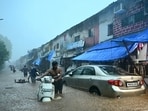 Commuters wade through a severely waterlogged road at Malabar Hill area following heavy rainfall, in Mumbai on Monday. Commuters wade through a severely waterlogged road at Malabar Hill area following heavy rainfall, in Mumbai on Monday.