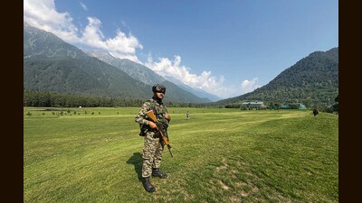 A security personnel guards during at Pahalgam Golf Course on Tuesday. (PTI) A security personnel guards during at Pahalgam Golf Course on Tuesday. (PTI)