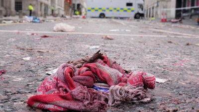 A fan scarf lies near the site where a 53-year-old British man plowed a minivan into a crowd of Liverpool soccer fans who were celebrating the city's Premier League championship Monday, injuring more than 45 people in Liverpool, England, Tuesday, May 27, 2025.(AP Photo/Jon Super) (AP) A fan scarf lies near the site where a 53-year-old British man plowed a minivan into a crowd of Liverpool soccer fans who were celebrating the city's Premier League championship Monday, injuring more than 45 people in Liverpool, England, Tuesday, May 27, 2025.(AP Photo/Jon Super) (AP)