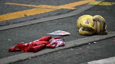 A discarded child's octopus soft toy, and a Liverpool flag lays in the road behind a police cordon on Water Street in Liverpool, north-west England on May 27, 2025, after a car ploughed in to crowds gathered to watch an open-top bus victory parade for Liverpool's Premier League trophy parade on May 26. Police said Monday they were not treating a Liverpool car ramming which left 27 people hospitalised as terrorism, after a vehicle ploughed into crowds celebrating Liverpool's Premier League football title. "We believe this to be an isolated incident, and we are not currently looking for anyone else in relation to it," Merseyside Police Assistant Chief Constable Jenny Sims told a press conference, adding a 53-year-old British man had been arrested. (Photo by Paul ELLIS / AFP) (AFP) A discarded child's octopus soft toy, and a Liverpool flag lays in the road behind a police cordon on Water Street in Liverpool, north-west England on May 27, 2025, after a car ploughed in to crowds gathered to watch an open-top bus victory parade for Liverpool's Premier League trophy parade on May 26. Police said Monday they were not treating a Liverpool car ramming which left 27 people hospitalised as terrorism, after a vehicle ploughed into crowds celebrating Liverpool's Premier League football title. "We believe this to be an isolated incident, and we are not currently looking for anyone else in relation to it," Merseyside Police Assistant Chief Constable Jenny Sims told a press conference, adding a 53-year-old British man had been arrested. (Photo by Paul ELLIS / AFP) (AFP)