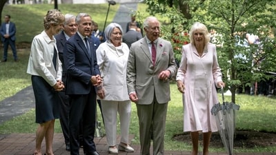 (L-R) Diana Fox Carney, Canadian Prime Minister of Canada Mark Carney, Governor General of Canada Mary Simon, Britain's King Charles III and Queen Camilla arrive to participate in a ceremonial tree planting at the official residence of the Governor General of Canada, Rideau Hall, in Ottawa, on May 26, 2025. (AFP) (L-R) Diana Fox Carney, Canadian Prime Minister of Canada Mark Carney, Governor General of Canada Mary Simon, Britain's King Charles III and Queen Camilla arrive to participate in a ceremonial tree planting at the official residence of the Governor General of Canada, Rideau Hall, in Ottawa, on May 26, 2025. (AFP)