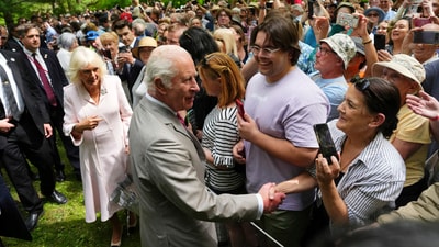 King Charles and Queen Camilla greet people as they walk towards Rideau Hall after taking part in a tree planting ceremony in Ottawa, Canada, during a royal visit on Monday, May 26, 2025. (Sean Kilpatrick/The Canadian Press via AP) (AP) King Charles and Queen Camilla greet people as they walk towards Rideau Hall after taking part in a tree planting ceremony in Ottawa, Canada, during a royal visit on Monday, May 26, 2025. (Sean Kilpatrick/The Canadian Press via AP) (AP)