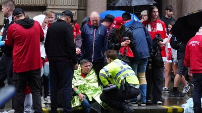 Liverpool horror aftermath: Around twenty people were treated on the scene, and 27 more were hospitalised after a car ploughed into a crowd of fans. (AP) Liverpool horror aftermath: Around twenty people were treated on the scene, and 27 more were hospitalised after a car ploughed into a crowd of fans. (AP)