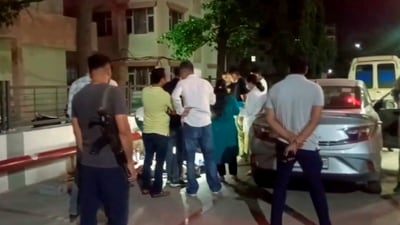 Panchkula: Police and officials investigate at the site after seven members of a family from Dehradun allegedly consumed poison and died in a car. (PTI) Panchkula: Police and officials investigate at the site after seven members of a family from Dehradun allegedly consumed poison and died in a car. (PTI)